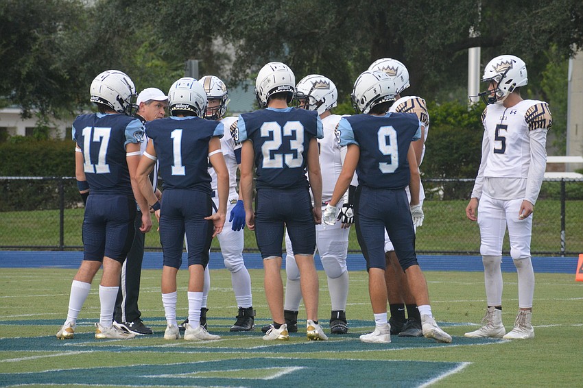 ODA captains Connor Pope (17), Ashton Lamb (1), Grady Paxton (23) and Isaiah Birch (9) take the field for the coin toss.