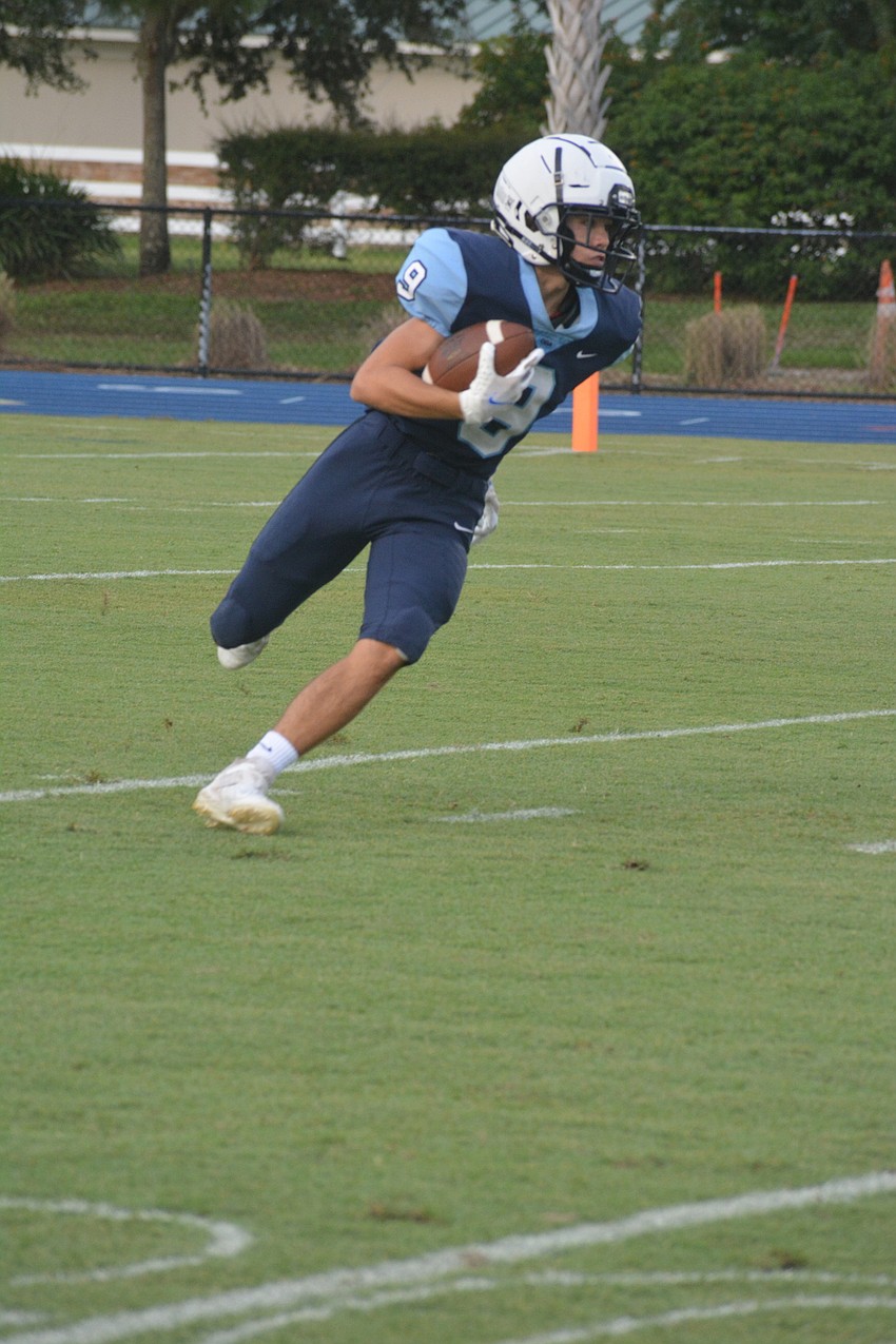 ODA junior Isaiah Birch returns the game's opening kickoff.