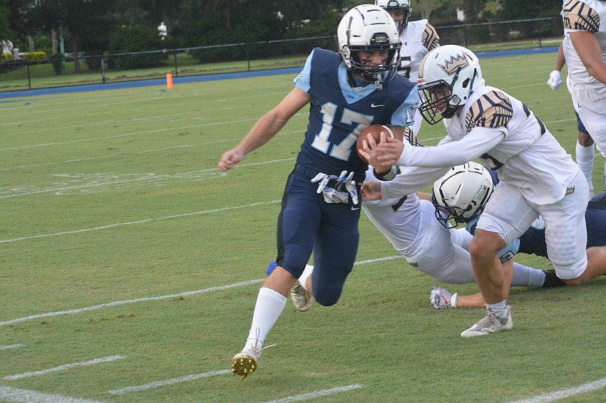 Connor Pope picks up yardage on a quarterback scramble.