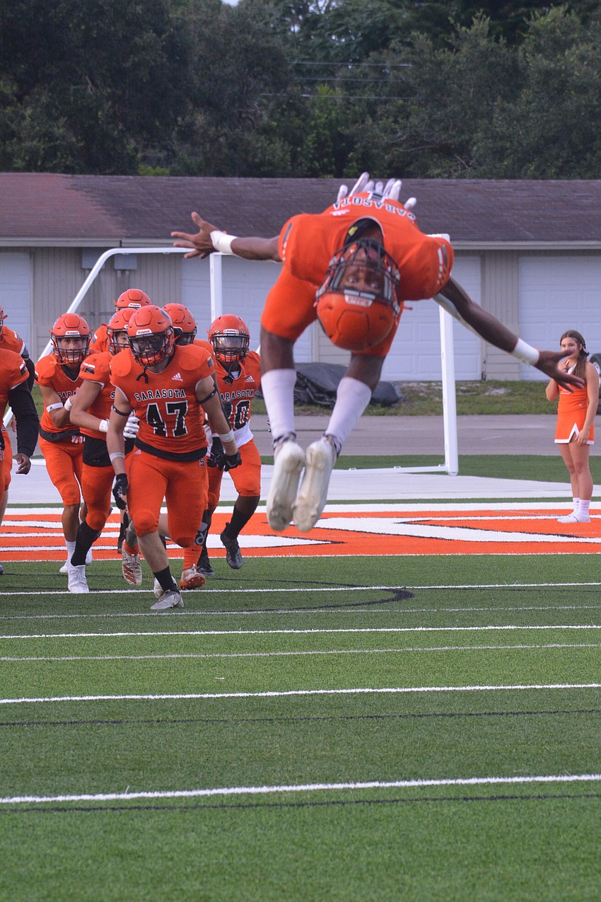 Sophomore Tyler Pack flips as the Sailors take the field.