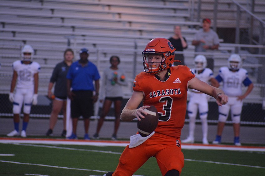 Sailors senior quarterback Lance Trippel looks for an open receiver downfield.