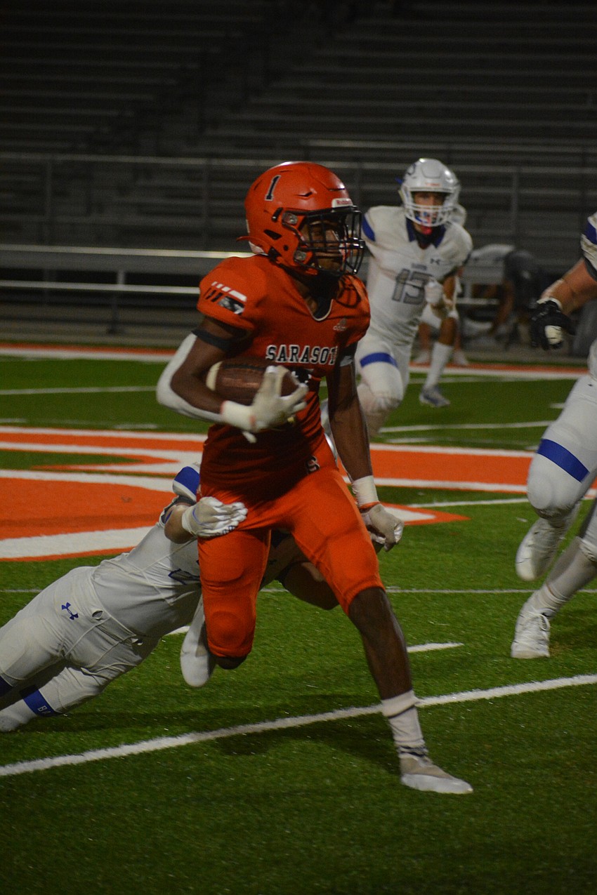 Sailors sophomore Tyler Pack returns an interception against Barron Collier. Pack returned the pick for a touchdown but the return was negated by a Sailors penalty.