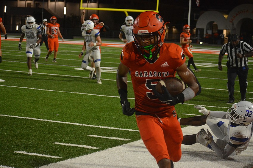 Sailors senior wideout Olajawon Mitchell runs out of bounds after catching a pass.