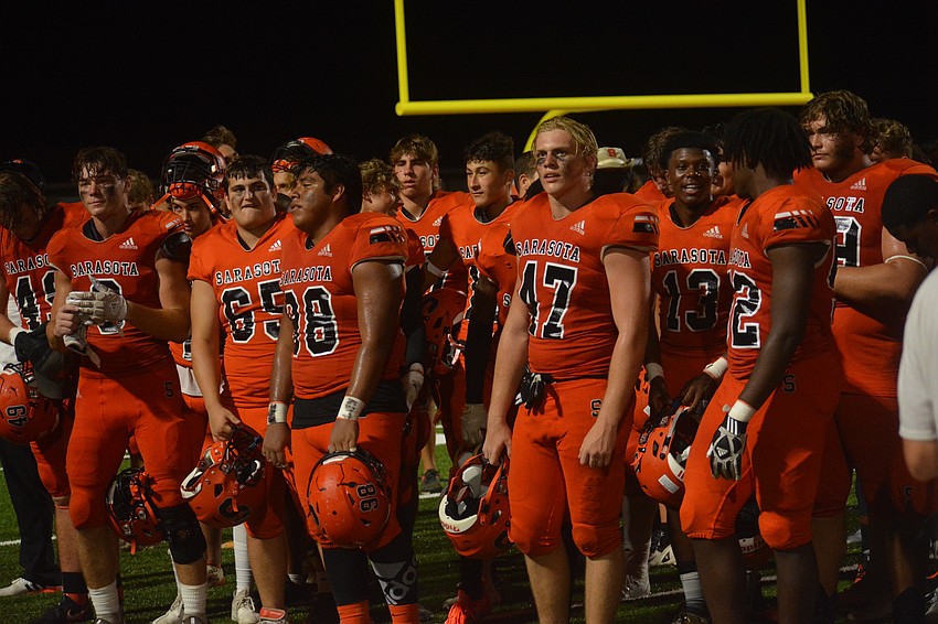 The Sailors look at the home crowd as the band plays the school's song.