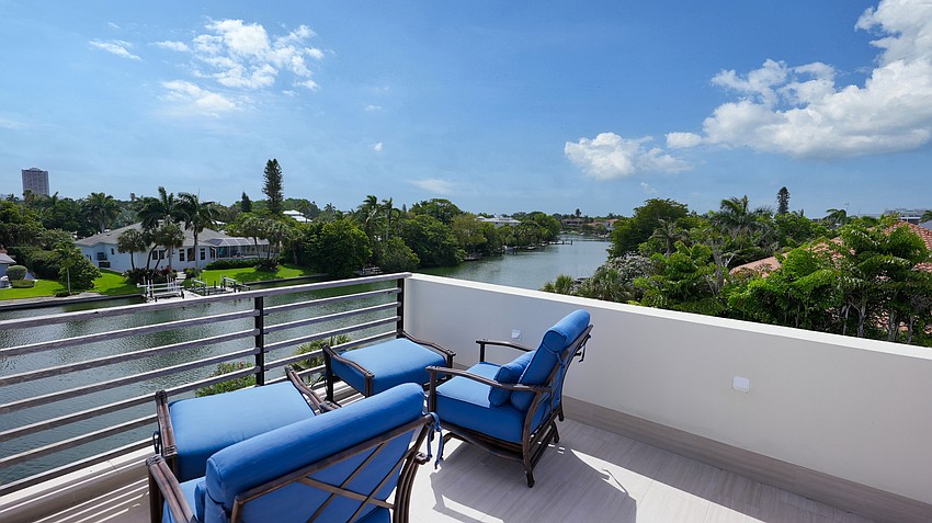 A sun deck on the upper level overlooks the canals of John Ringling Estates.