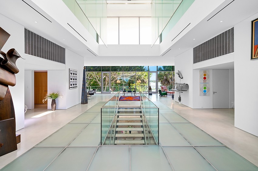 The home features floor-to-ceiling windows and lots of natural light.