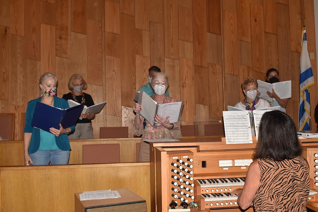 Your Observer | Photo - Ann Stephenson-Moe leads her choir in their ...