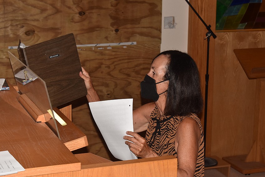 Ann Stephenson-Moe changes sheet music.