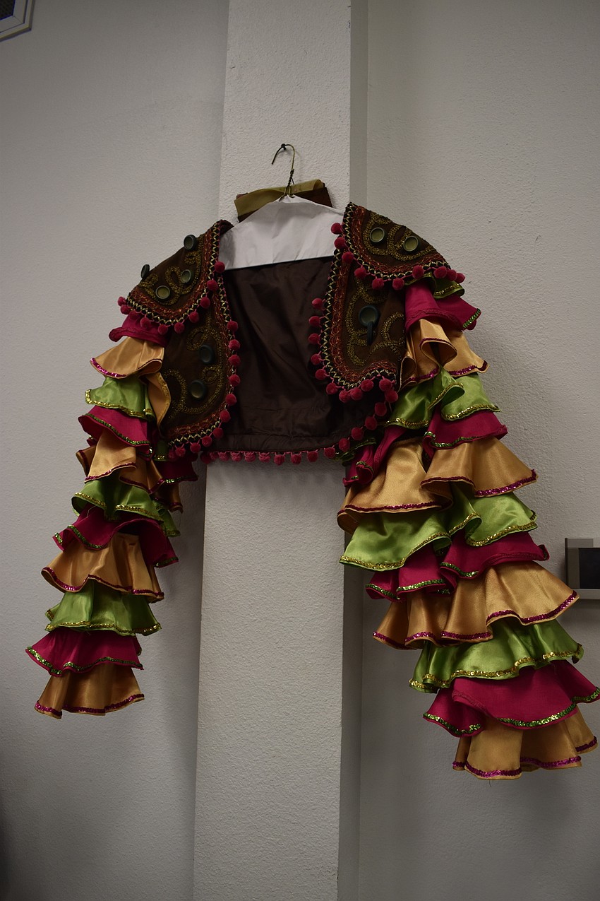 Hold a Marguerita in hand at a  Cinque de Maya party wearing this festival Mexican vest.