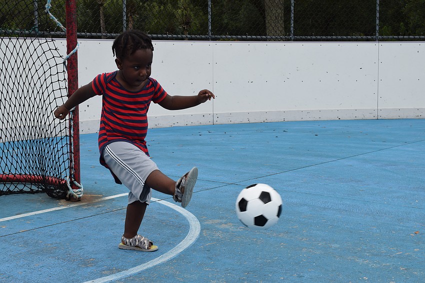 Lakewood Ranch's Az Fortune, who is 2, launches the ball across the field.