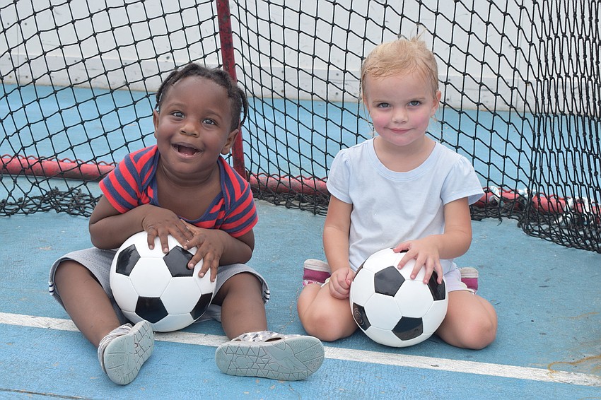 Lakewood Ranch's Az Fortune and Kali Hill, who are both 2 years old, enjoy the Peewee Soccer event hosts by Lakewood Ranch Community Activities.