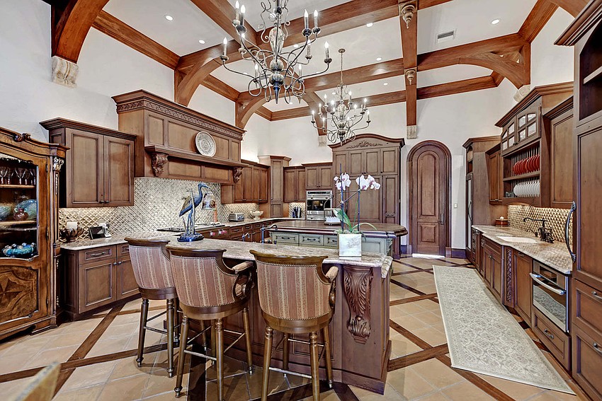 he interior scheme is a showcase of stunning features, including elaborate ceiling treatments with naturally stained wood beams & barrel vault construction.