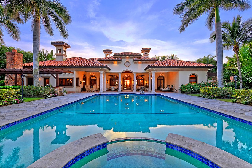 The outdoor entertaining area features an extended sundeck surrounding the heated saltwater swimming pool and raised spa, covered dining and lounge area.