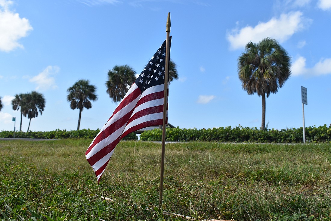 Town staffers place 2,974 flags along Gulf of Mexico Drive, beginning Sept. 10.