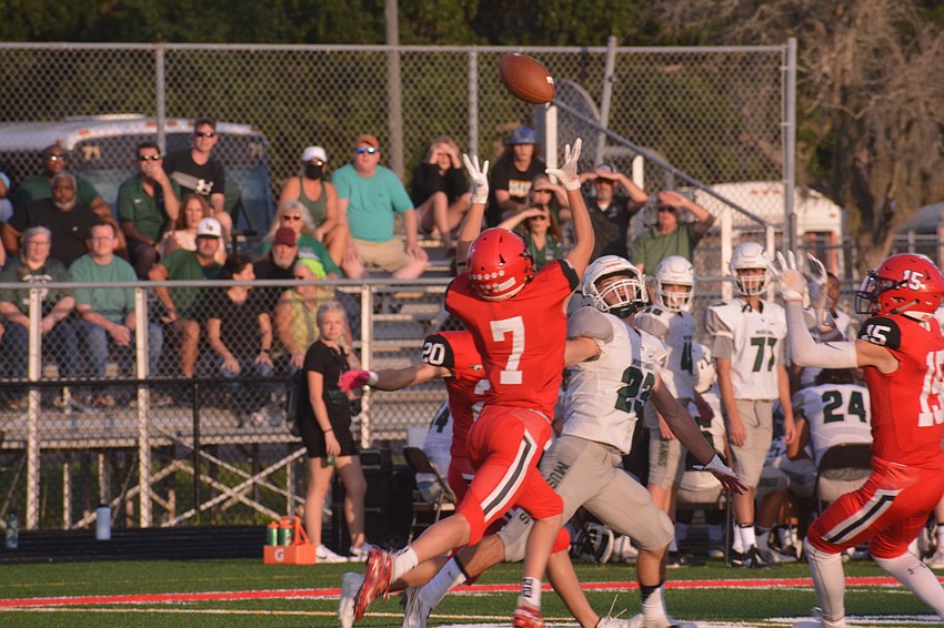 Cardinal Mooney defensive back Kalvin Schultz breaks up a pass from Lakewood Ranch quarterback Cameron Madison to senior Marlowe Walker.