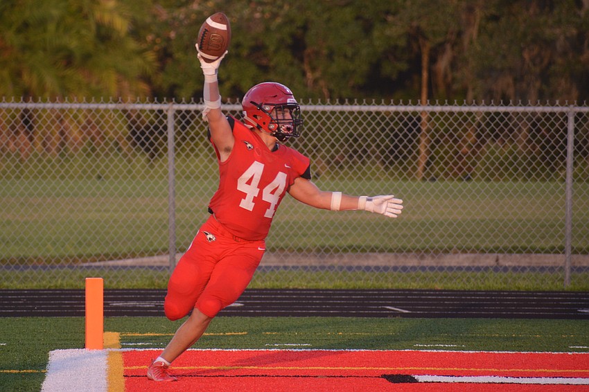 Cardinal Mooney junior J.R. Rosenberg celebrates after catching a touchdown from senior Tayven Clark.