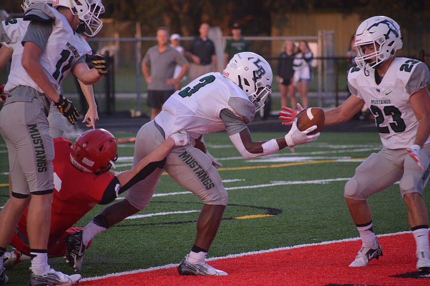 Lakewood Ranch junior running back Kevin Everhart muscles his way into the end zone.
