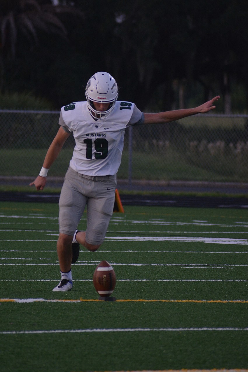 Lakewood Ranch senior kicker Drew Clark kicks off after a Mustangs touchdown.