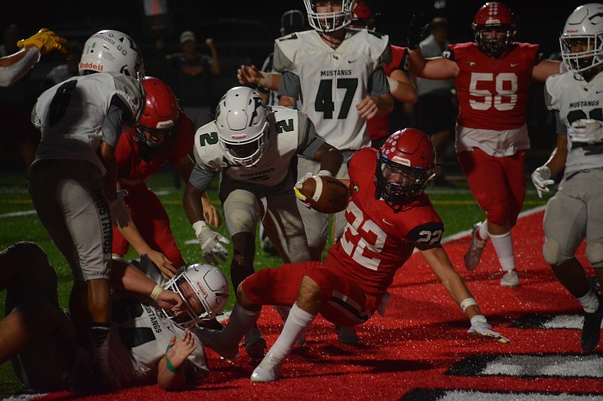 Cardinal Mooney sophomore Carson Beach stumbles into the end zone.