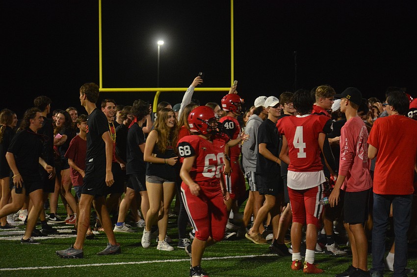 Cardinal Mooney students stormed the field after the 35-30 win.