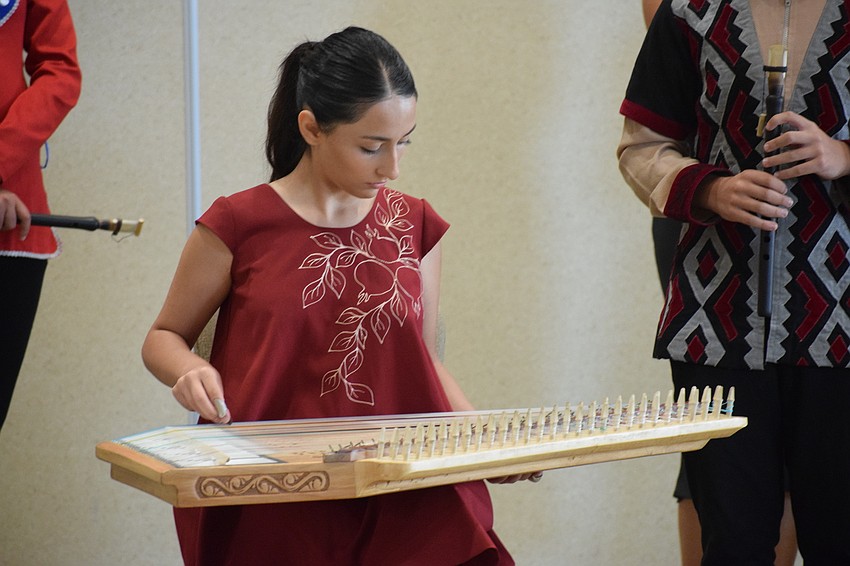 Lilit Petrosyan plays a qaran softly in a trio.