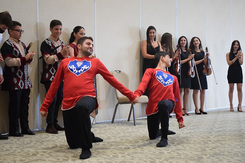 Emil Abrahamyan and Alex Danielyan perform a dance that is traditionally done before battle.