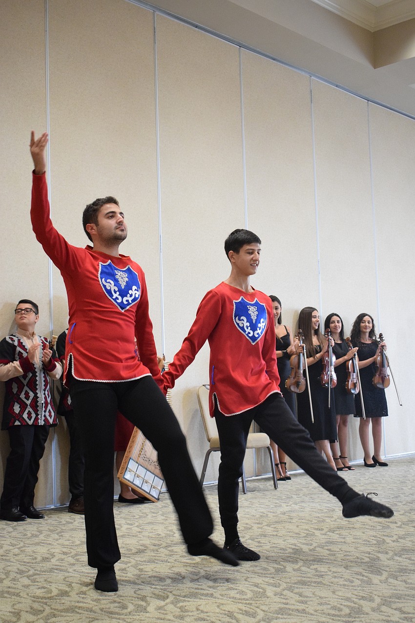 Emil Abrahamyan and Alex Danielyan perform a dance that is traditionally done before battle.