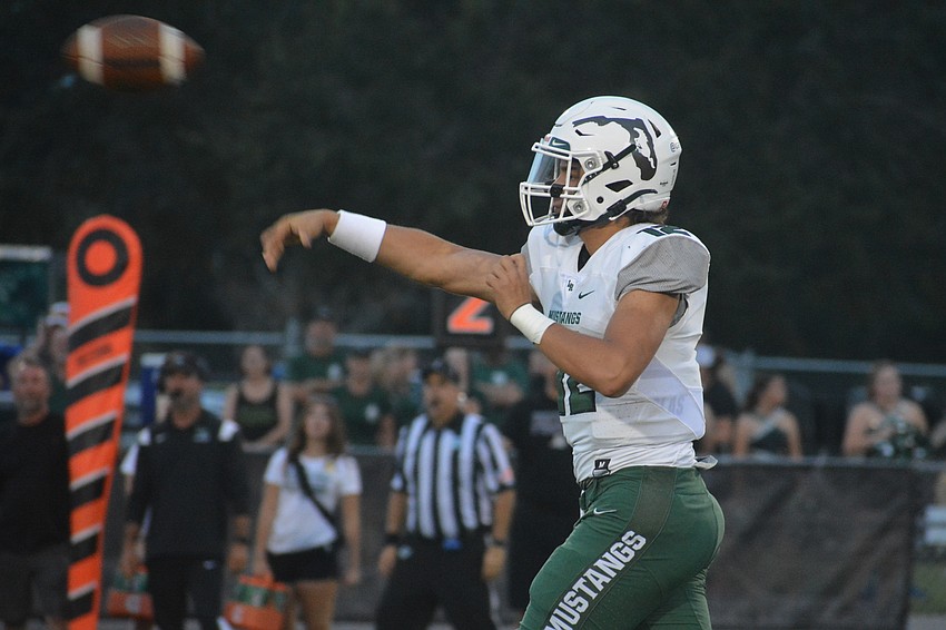 Lakewood Ranch High quarterback Cameron Madison fires a pass over the middle.
