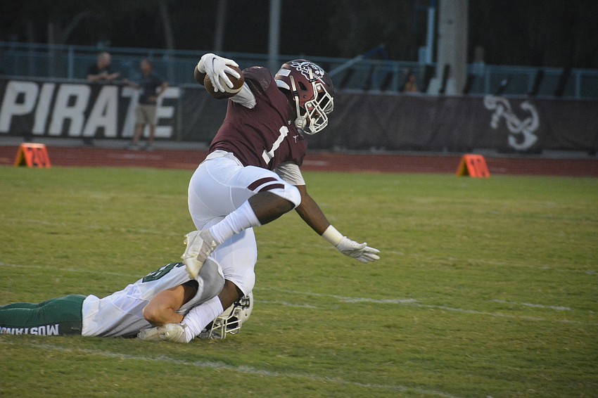 Braden River running back Justice McDaniel gets upended by Lakewood Ranch.