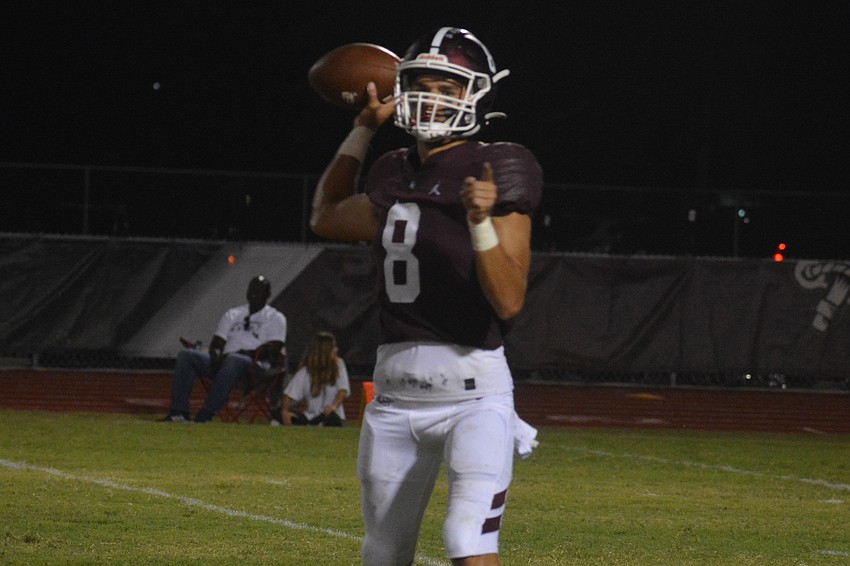 Braden River High sophomore quarterback Nick Trier fires a pass to his left.