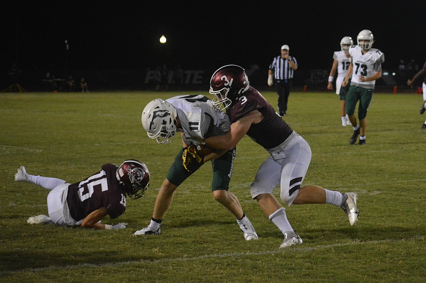 Lakewood Ranch wide receiver Isaac Ashley is hit by Braden River linebacker Aidan Dangler.
