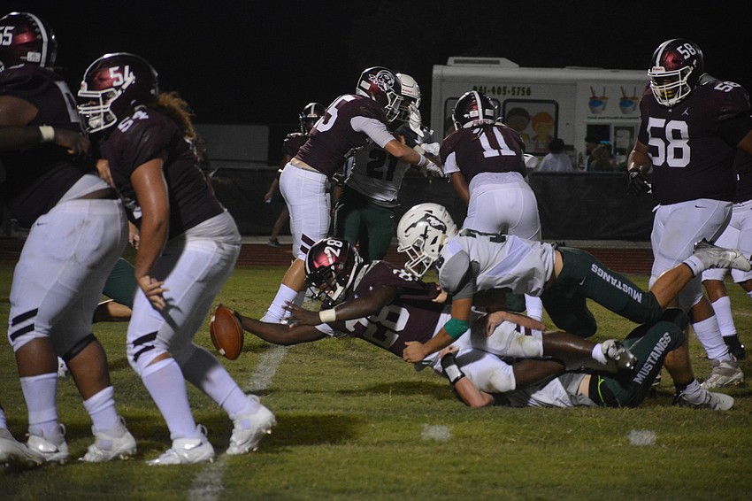 Braden River running back Trayvon Pinder reaches across the goal line for a touchdown.