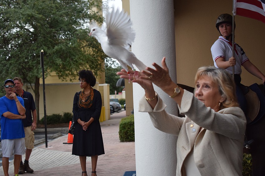 Manatee County Commissioner Vanessa Baugh releases a rock dove at the end of the Day of Remembrance memorial in Lakewood Ranch.