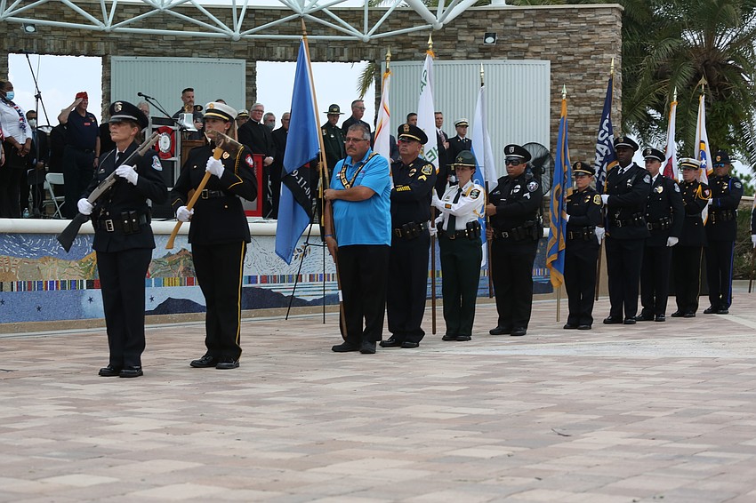 Sarasota police, fire and sheriff honor guard figures performed the posting of the colors.