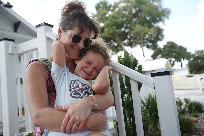 Heather Scmitz and Leah Bailey listen to music.
