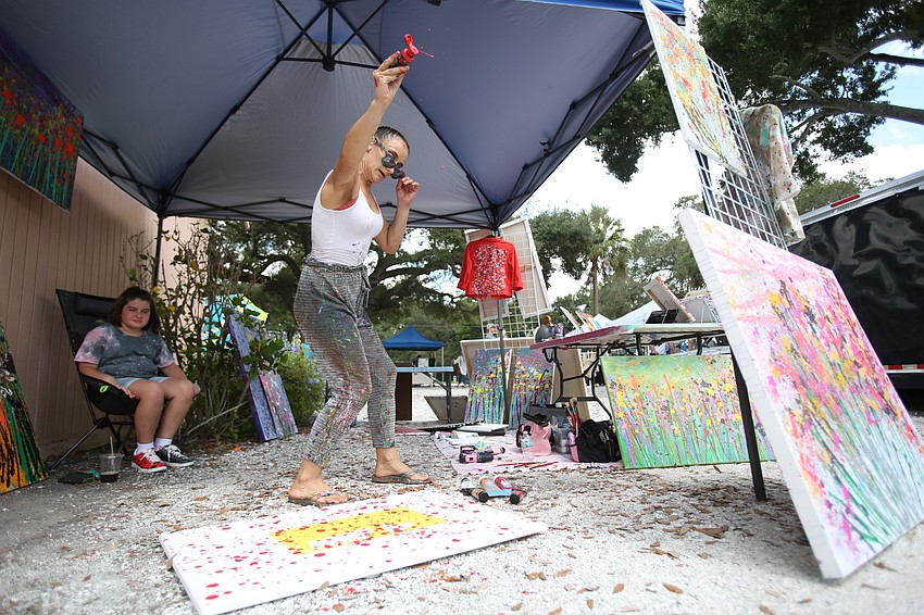 Drita Hajroja of the Drita Dawn business works on her art.