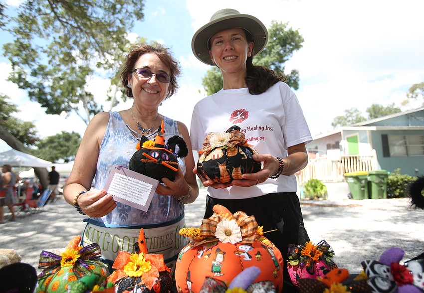 Gina Stapleton and Josee Ariel sell handmade art crafts.