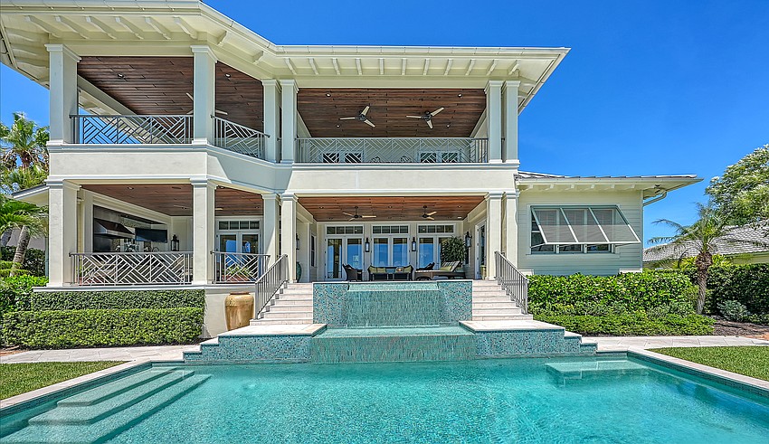 The two-story home overlooks the bayfront pool deck from several vantage points.