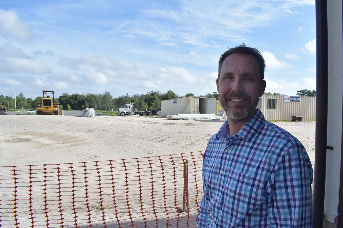 William Skaggs, the CEO of the Players Centre for Performing Arts, stands in front of the theater&#39;s future home at Waterside Place.