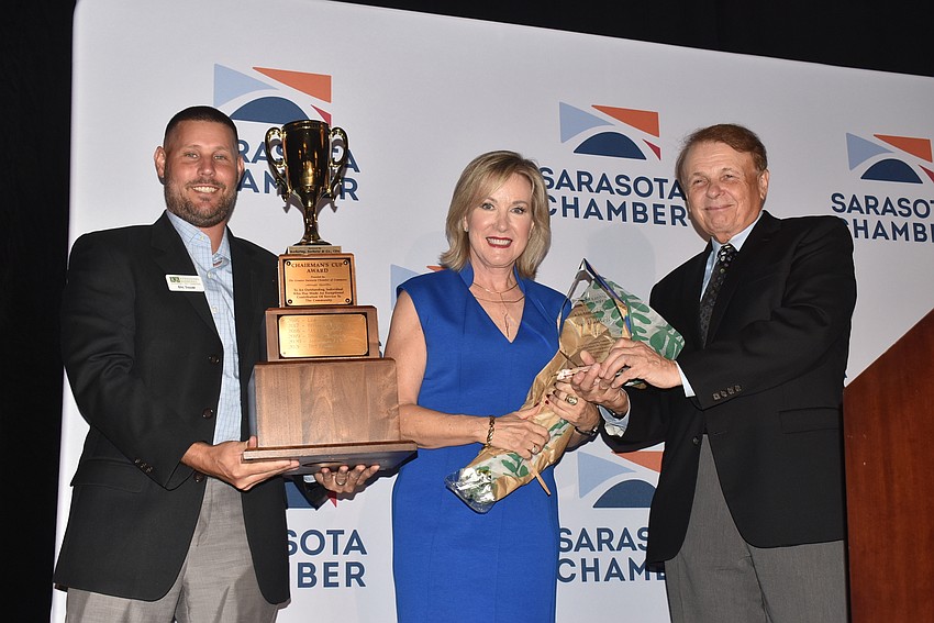 Eric Troyer and Larry Thompson presented Teri Hansen with the Chair's Cup Award.