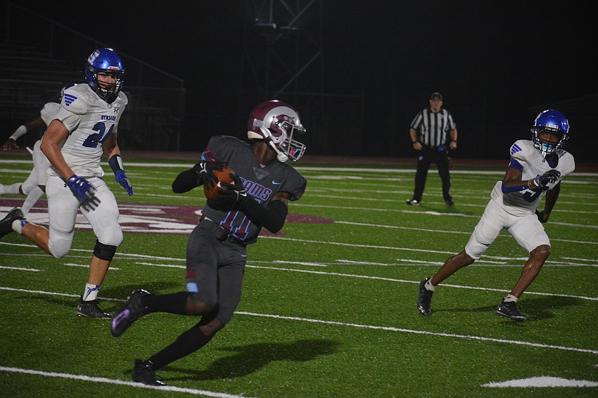 Johnell Williams turns upfield after catching a pass from Joe Borchers.