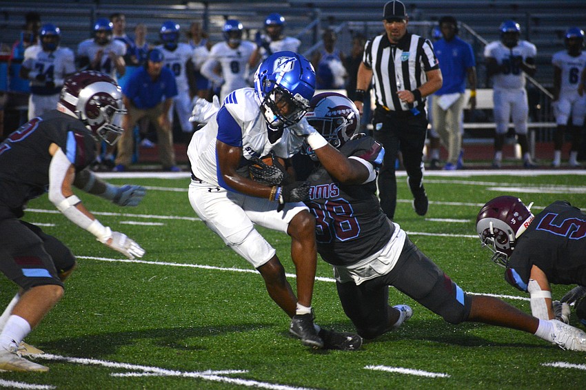 Three Rams defenders converge on a Sebring wide receiver.
