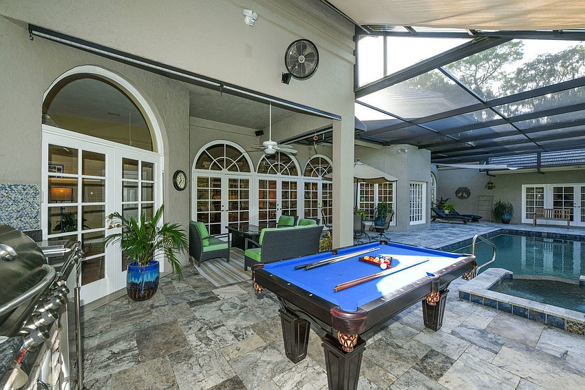 The pool area features an adjacent gaming space.