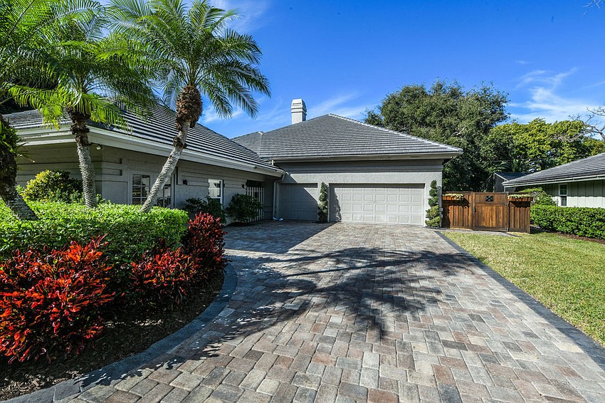 The home is situated on an oversized private lot with extensive landscaping.