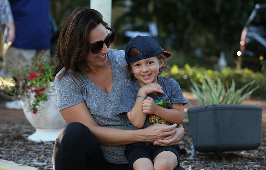Lindsay and Niko Nappo wait to see Leo Nappo sing.