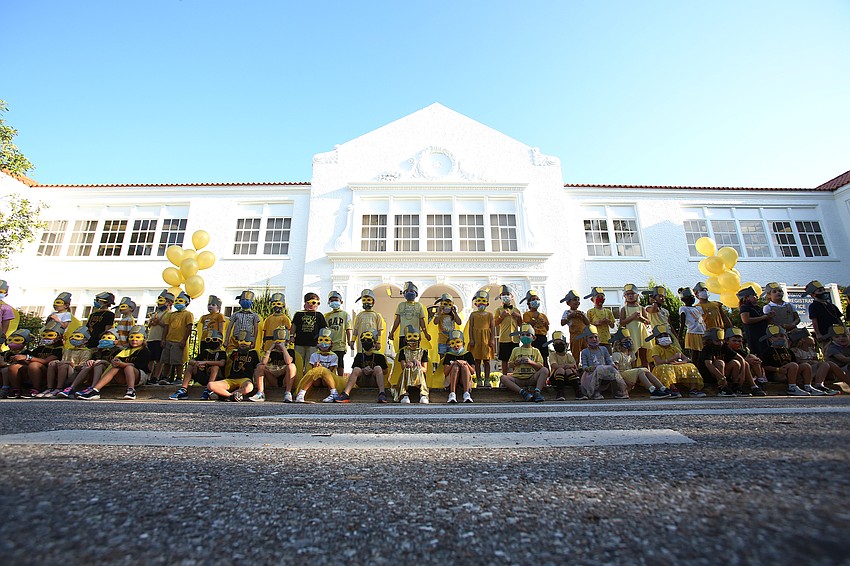 The school's kindergarten classes sing as one.