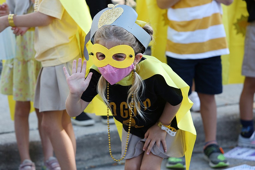 Shayla Fisher waves to a friend.