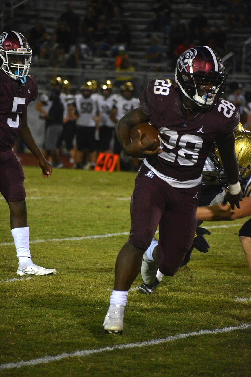 Trayvon Pinder bursts up the middle of the field.