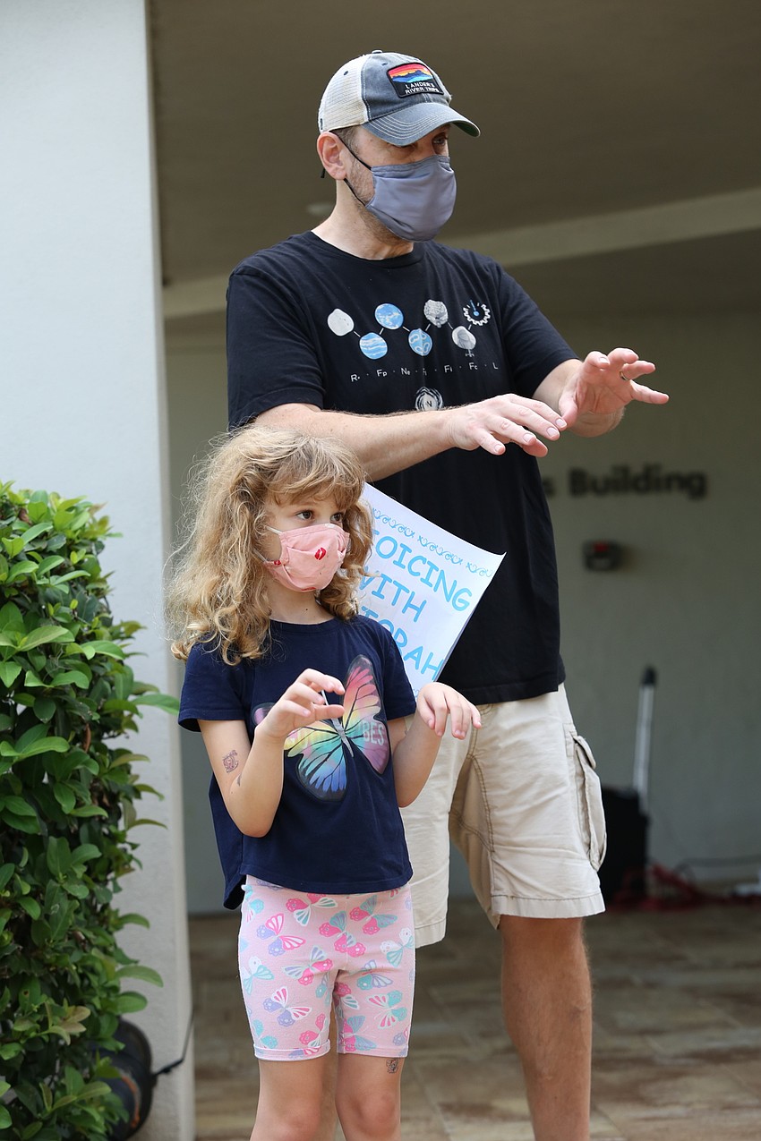 Samaya and Brian Laeger sing along as cats.