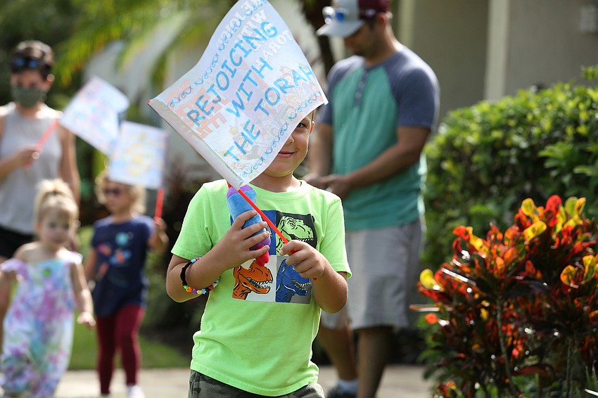 Nathan Geffre joins in the parade.